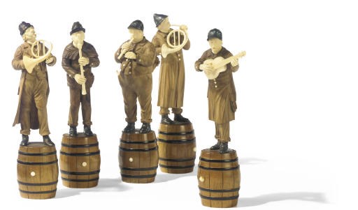 A GROUP OF FIVE AUSTRIAN CARVED WOOD AND IVORY FIGURES OF MUSICIANS
