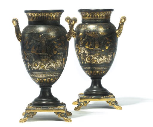 A PAIR OF DAMASCENED BRONZE URNS