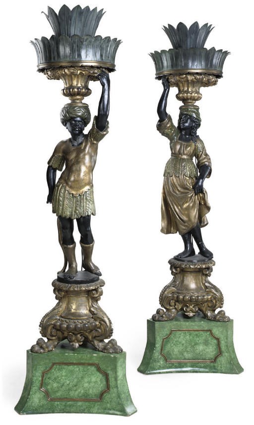 A PAIR OF ITALIAN PARCEL-GILT POLYCHROME-DECORATED BLACKAMOOR TORCHERES