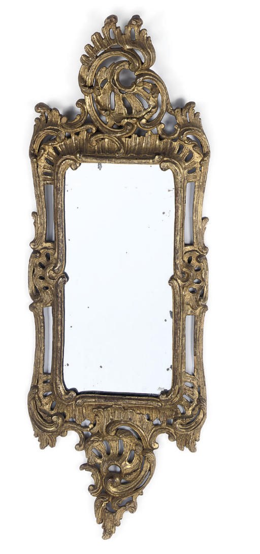 A GERMAN CARVED GILTWOOD MIRROR