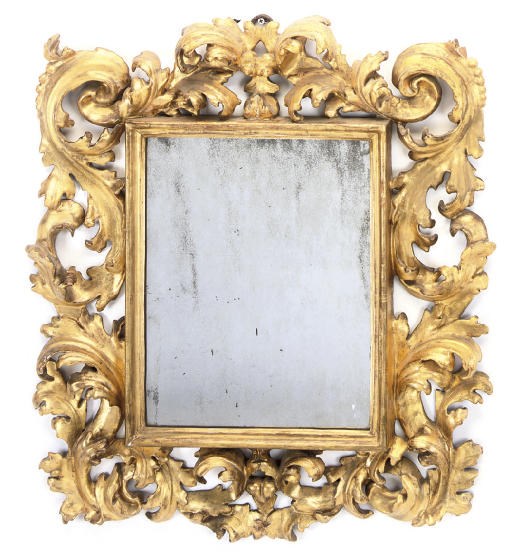 AN FLORENTINE CARVED GILTWOOD MIRROR