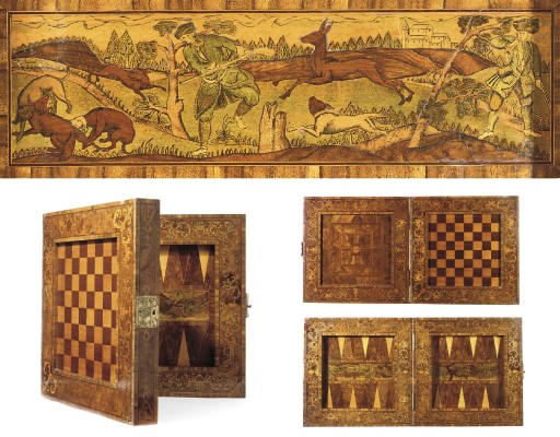 A SOUTH GERMAN WALNUT, FRUITWOOD, AMARANTH AND MARQUETRY FOLDING GAMES BOARD
