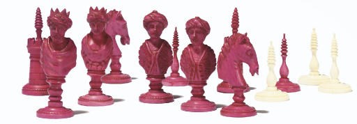 A GERMAN CARVED IVORY BUST TYPE CHESS SET