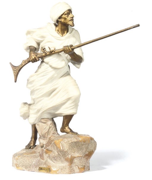 A GILT-BRONZE AND MARBLE FIGURE OF A NORTH AFRICAN TRIBESMAN