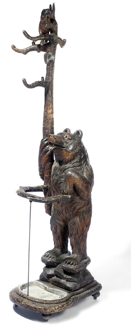 A SWISS 'BLACK FOREST' CARVED WOOD HALL STAND
