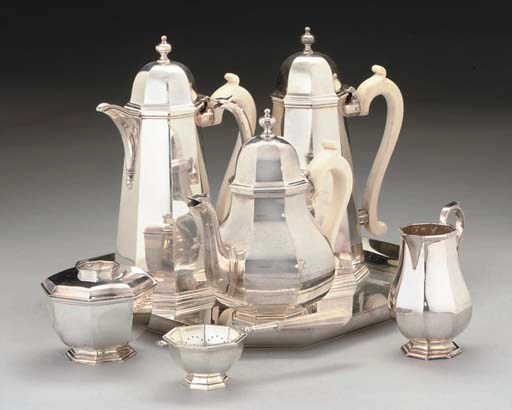 A FIVE-PIECE SILVER OCTAGONAL TEA & COFFEE SET IN GEORGE I STYLE, WITH MATCHING TRA-STRAINER & STAND & A MATCHING TRAY,