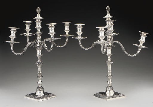 A PAIR OF MODERN FIVE-LIGHT SILVER CAST CANDELABRA,