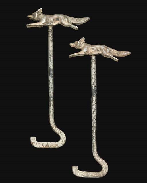A PAIR OF VICTORIAN SILVER-MOUNTED STEEL BOOT JACKS,