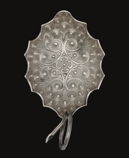 A WILLIAM IV SILVER LEAF BOWL CADDY SPOON,