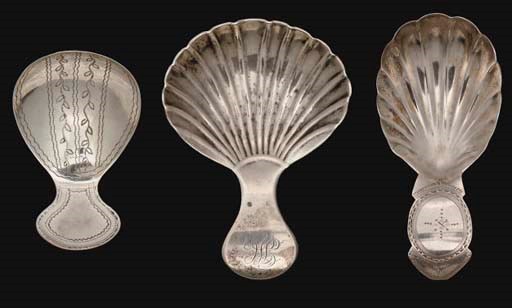 A GROUP OF THREE GEORGE III SILVER CADDY SPOONS,