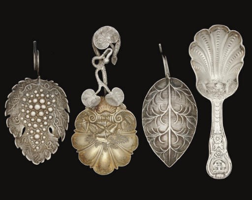 A GROUP OF FOUR SILVER CADDY SPOONS,