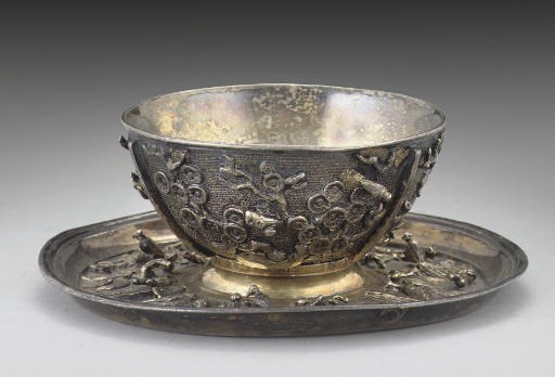 A SILVER-GILT TEA BOWL & SAUCER,