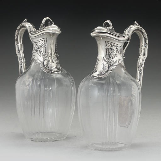 A PAIR OF FRENCH SILVER-MOUNTED GLASS CLARET JUGS,