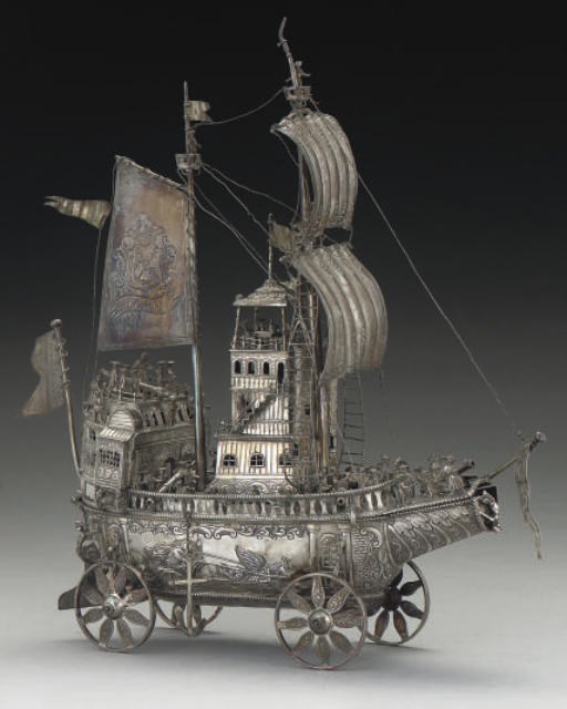 A LATE 19TH CENTURY DUTCH SILVER BOTTLE HOLDER FORMED AS A NEF,
