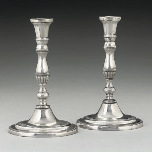 A PAIR OF LATE 18TH/EARLY 19TH CENTURY ITALIAN SILVER CAST CANDLESTICKS,