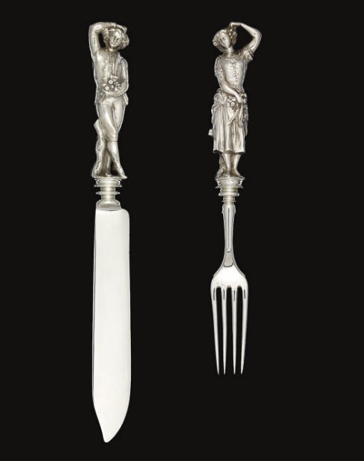 A VICTORIAN SILVER CAKE KNIFE & FORK WITH CAST FIGURAL HANDLES,