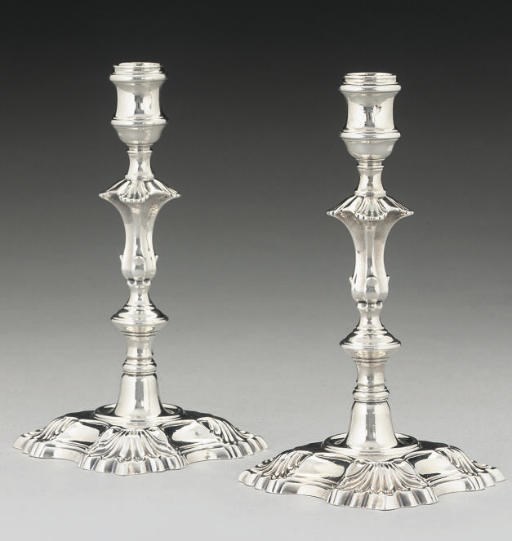 A PAIR OF GEORGE II SILVER CAST CANDLESTICKS,
