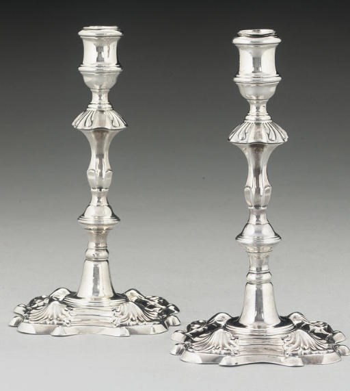 A PAIR OF GEORGE II SILVER CAST CANDLESTICKS,