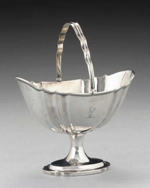 A GEORGE III IRISH SILVER SWING-HANDLED SUGAR BASKET,