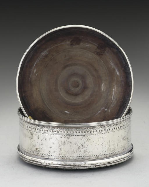 A MATCHED PAIR OF GEORGE III IRISH SILVER COASTERS,