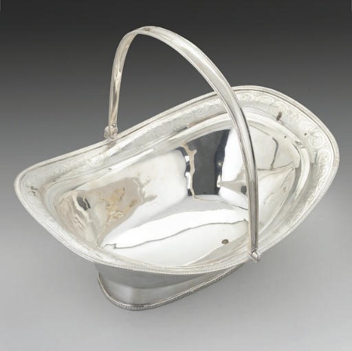 A GEORGE III IRISH SILVER SWING-HANDLED CAKE BASKET,