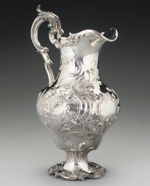 A VICTORIAN SILVER WATER JUG,