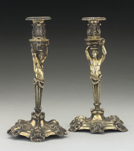 A PAIR OF VICTORIAN SILVER-GILT CAST FIGURAL CANDLESTICKS IN MID-18TH CENTURY STYLE,