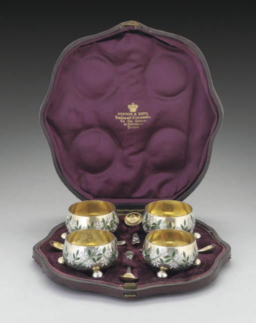 A SET OF FOUR VICTORIAN SILVER-GILT & CHAMPLEVE ENAMEL SALTS WITH SPOONS,