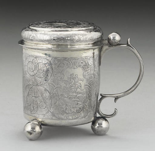 A MID-18TH CENTURY RUSSIAN PARCEL-GILT SILVER TANKARD,