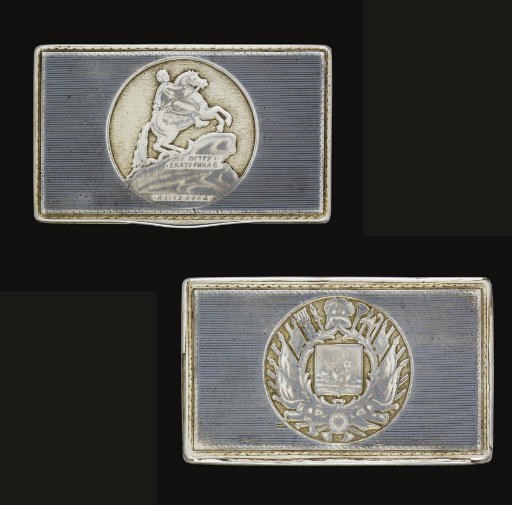 AN EARLY 19TH CENTURY RUSSIAN PROVINCIAL PARCEL-GILT SILVER & NIELLO SNUFF BOX,