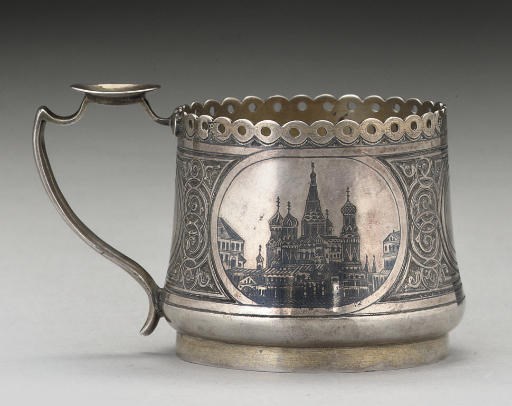 A 19TH CENTURY RUSSIAN PARCEL-GILT SILVER & NIELLO LEMON-TEA GLASS HOLDER,
