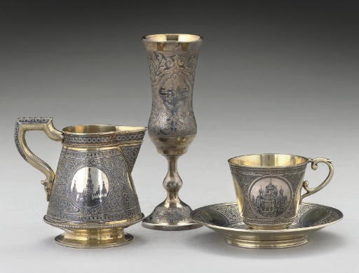 A 19TH CENTURY RUSSIAN PARCEL-GILT SILVER & NIELLO CREAM JUG,