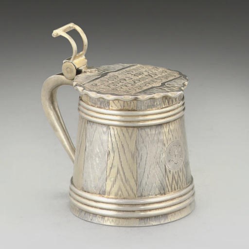 A 19TH CENTURY RUSSIAN PARCEL-GILT SILVER TROMPE L'OEIL CHILD'S TANKARD,