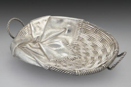 A 19TH CENTURY RUSSIAN SILVER TROMPE L'OEIL BREAD BASKET,
