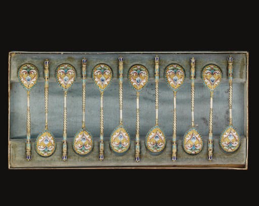 A SET OF TWELVE EARLY 20TH CENTURY RUSSIAN SILVER-GILT & CLOISONNE ENAMEL DEMI-TASSE SPOONS,