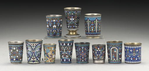 A GROUP OF ELEVEN SMALL RUSSIAN SILVER-GILT & CLOISONNE ENAMEL VODKA BEAKERS,