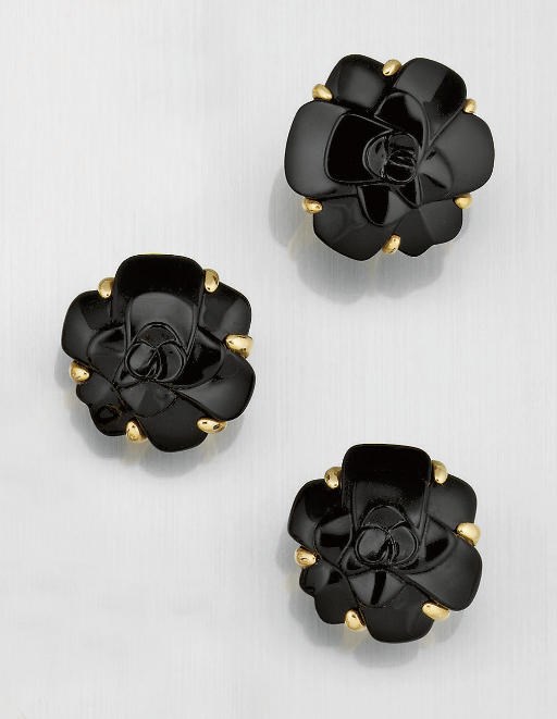 A pair of ceramic floral earclips and ring, by Chanel