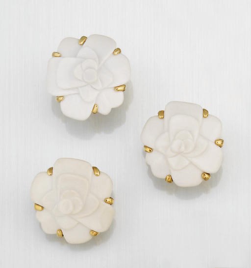 A pair of ceramic floral earclips and ring, by Chanel