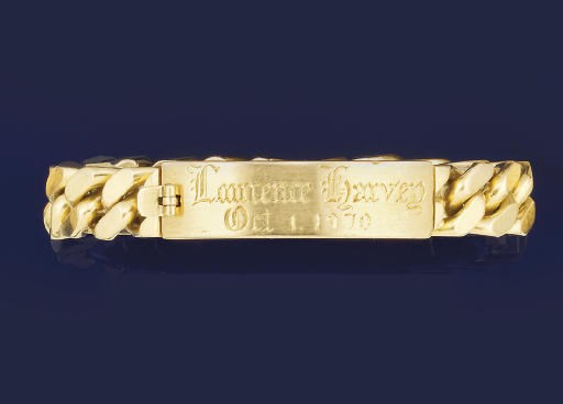 AN 18CT. GOLD IDENTITY BRACELET