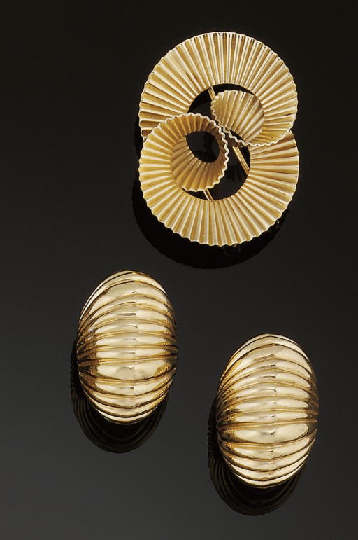 A pair of earclips and brooch, by Cartier