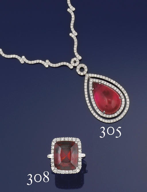 A GARNET AND DIAMOND CLUSTER RING