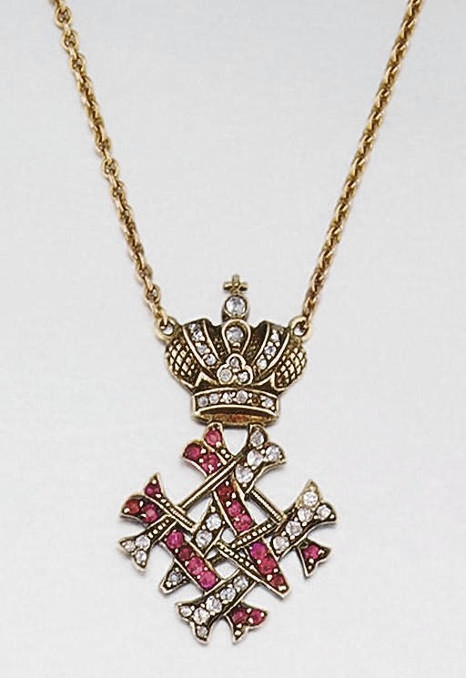 AN EARLY 20TH CENTURY RUBY AND DIAMOND MONOGRAM PENDANT
