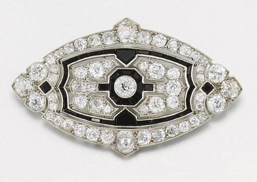 An Art Deco diamond and onyx brooch by Cartier