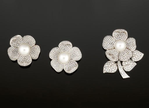 A cultured pearl and diamond brooch and earclips