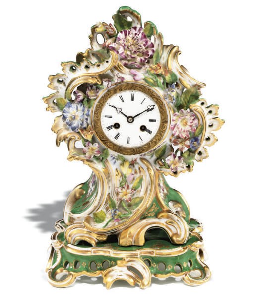 A FRENCH PORCELAIN GREEN-GROUND ROCOCO SCROLLED CLOCK CASE AND STAND