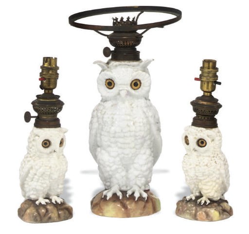 A SET OF THREE GERMAN PORCELAIN SPIRIT LAMPS MODELLED AS OWLS