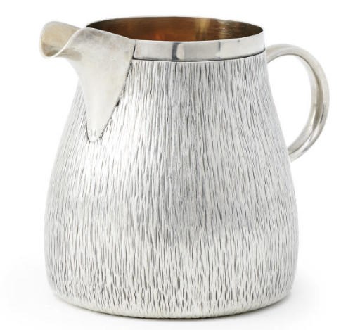 A MODERN GILT-LINED SILVER MILK JUG