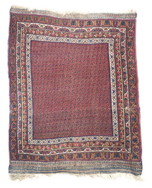 AN UNUSUAL WEST PERSIAN RUG