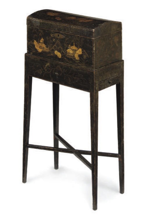 A GEORGE III BLACK JAPANNED DOMED TEA CHEST ON STAND