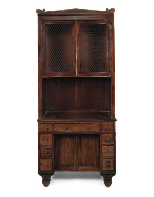 A REGENCY MAHOGANY KNEEHOLE BOOKCASE